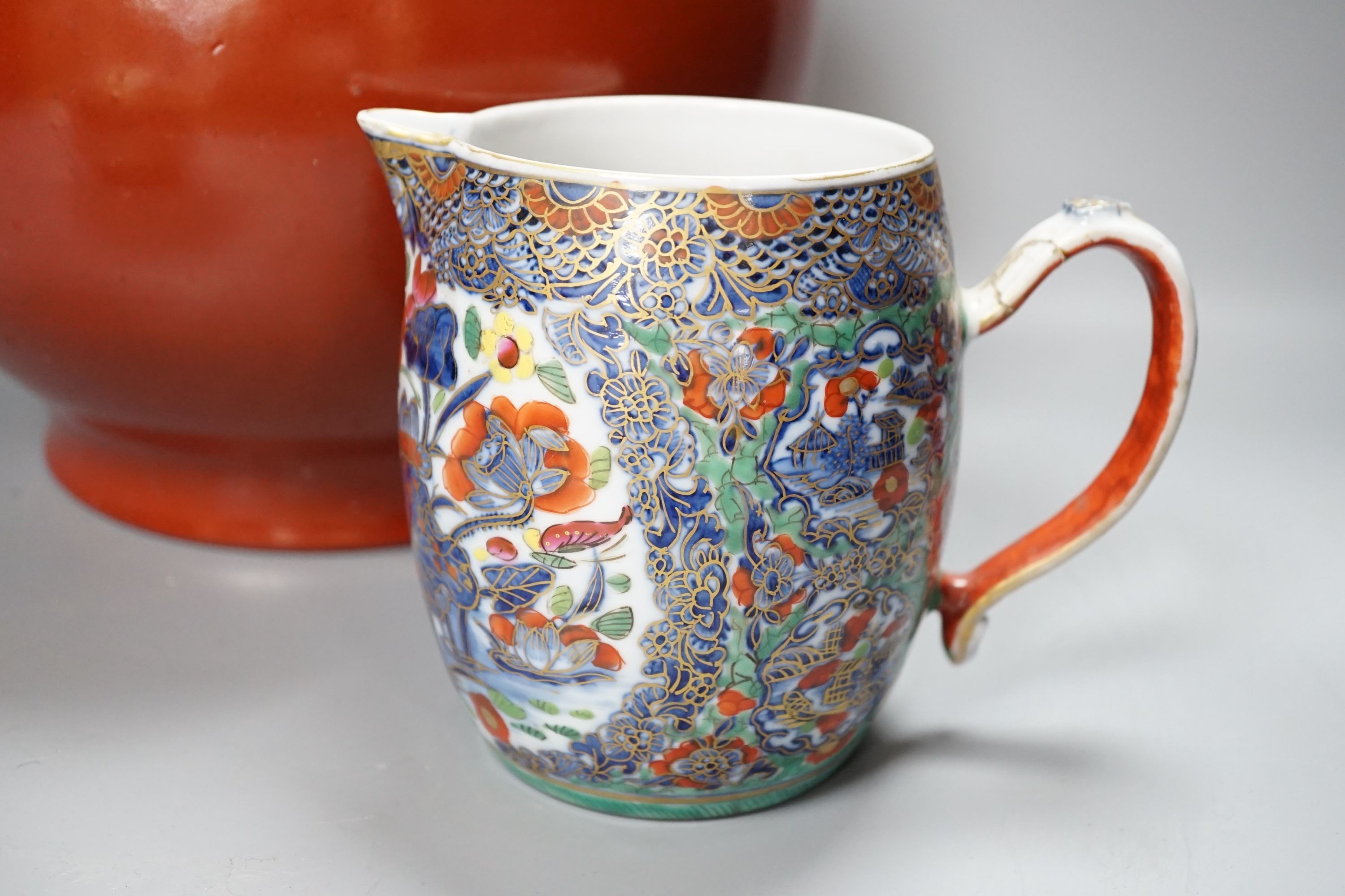 A 19th century Chinese famille rose pot and cover, 15cm diam., together with a decorative Chinese jug and large monochrome china pot